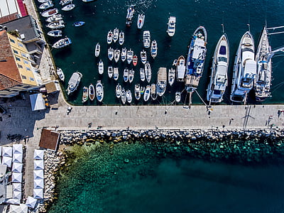 white boats on body of water near buildings thumbnail