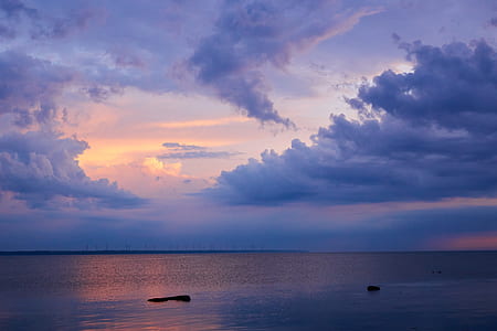 landscape photography of calm body of water during golden hour thumbnail