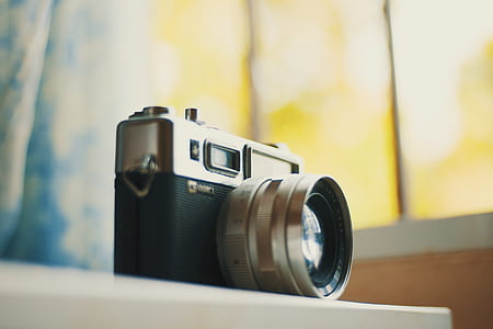 SLR camera on top of wood thumbnail