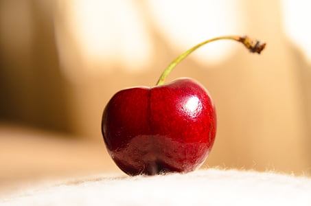 red cherry on white pad thumbnail