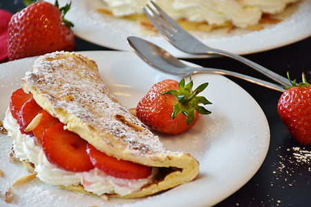 white flat bread with strawberries on top of white plate thumbnail