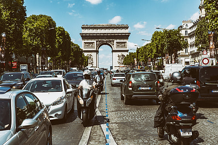 Wide angle shot of the busy road traffic on the famous Champs Elysees in Paris, France. At the end of the road you can see the Arc de Triomphe. This image was captured with a Canon 6D.  thumbnail
