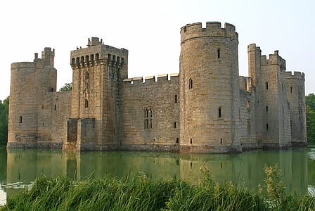 stone castle with water during daytime thumbnail