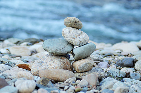 pile of stones near body of water at daytime thumbnail