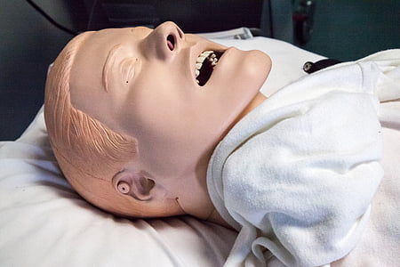 male head mannequin on white textile thumbnail