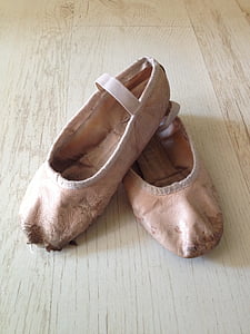 pair of pink leather ballet flats on wooden surface thumbnail