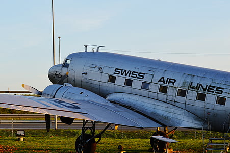 gray airplane on grassland thumbnail