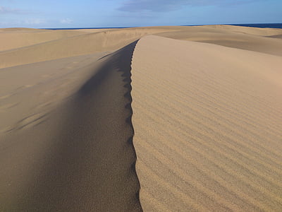 brown desert under blue sky thumbnail