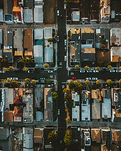 aerial photography of houses surrounded by cars and trees thumbnail