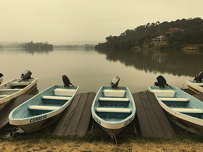 aligned punt boats on dock thumbnail