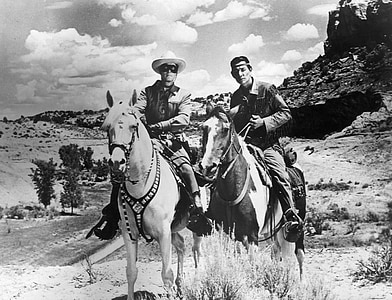 two man riding on horses thumbnail
