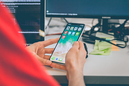 person holding silver iPhone X thumbnail