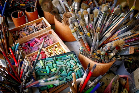 assorted-color pencils and makeup brushes thumbnail