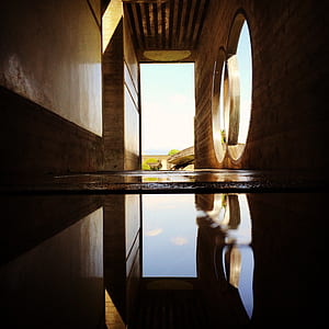 brown hallway by water thumbnail