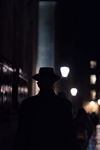 silhouette photo of man wearing hat thumbnail