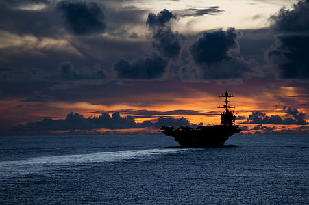 aircraft carrier on body of water thumbnail