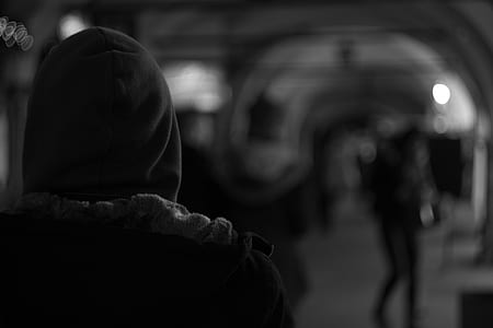 grayscale photography of a person standing thumbnail