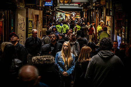 woman wearing denim long sleeve and standing center of many peoples thumbnail