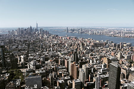 aerial photography of buildings near sea during daytime thumbnail