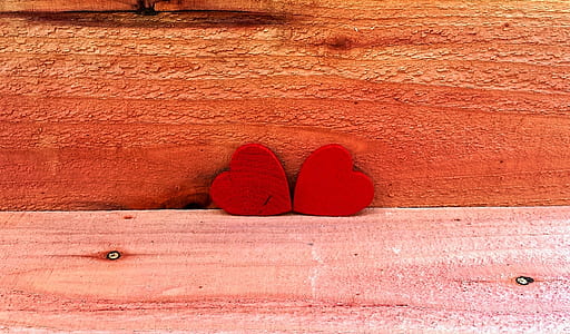 two red heart ornaments thumbnail