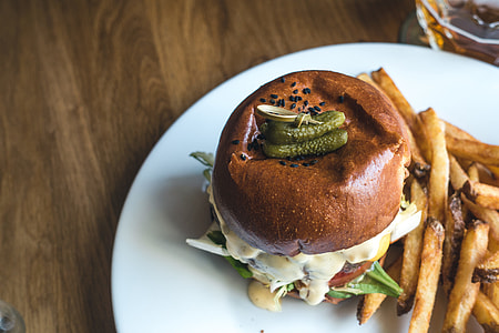 Tiny pickles on top of burger thumbnail