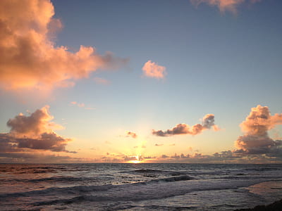 body of water under blue sky thumbnail