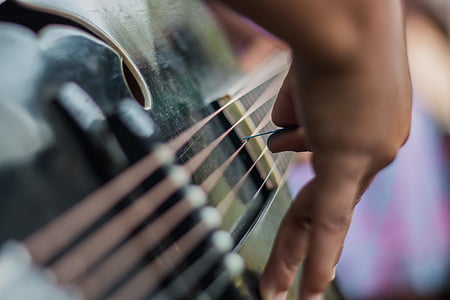 person playing black guitar thumbnail