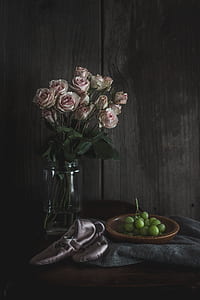 pink flowers on clear glass vase thumbnail
