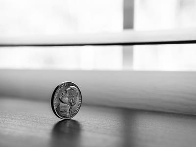 Monochrome Photography of Round Silver Coin thumbnail