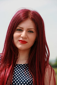 woman wearing black and white dotted sleeveless top thumbnail