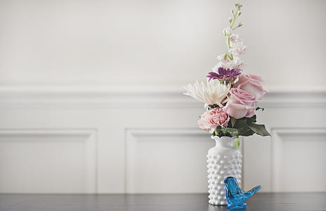 pink rose in white vase thumbnail