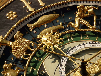 closeup photo of gold-colored and green zodiac sign tower clock thumbnail