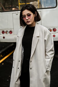 woman wearing black dress and gray coat thumbnail