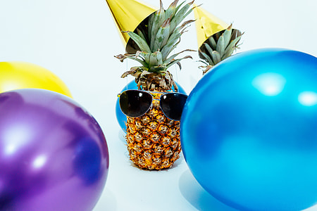 pineapple fruit with sunglasses near balloons thumbnail