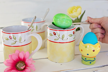 person holding spoon with easter egg toy thumbnail