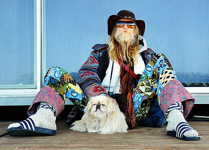man sitting together with his dog thumbnail