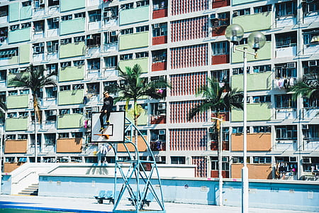 man at the top board of basketball ring thumbnail