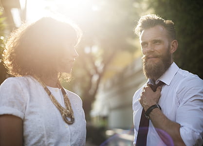 man watching woman selective photography thumbnail