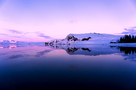 landscape photography of mountain and lake during daytime thumbnail