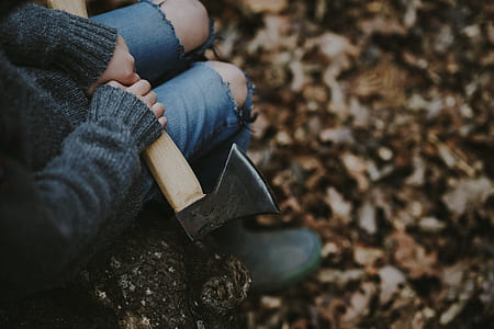 person sitting holding axe thumbnail
