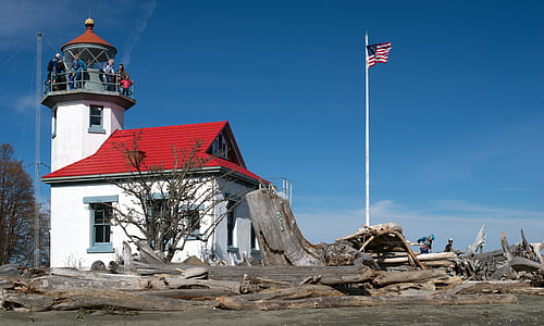 flag of USA near white and red house thumbnail