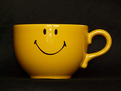 selective focus photography of yellow ceramic cup thumbnail