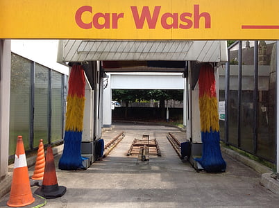 three traffic cones near car wash signage thumbnail