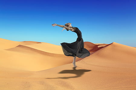 woman performing in desert thumbnail
