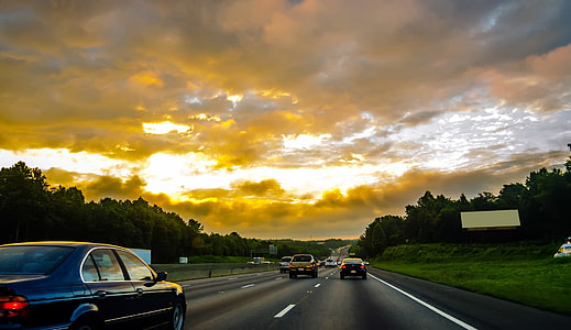 photo of concrete road filled with cars during day time thumbnail