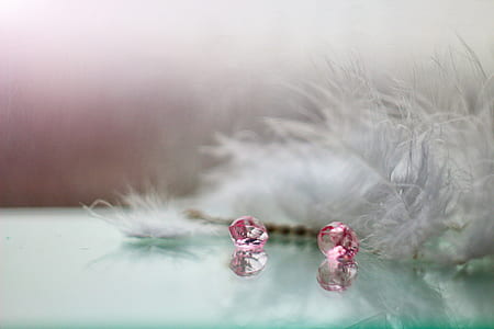 shallow focus photography of two pink gemstones thumbnail