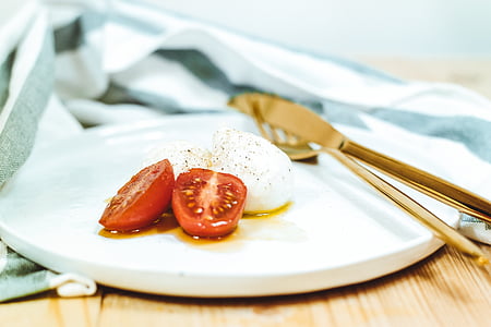 sliced tomato on white ceramic plate thumbnail