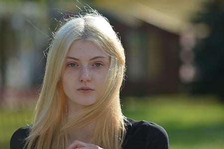 photo of woman wearing black scoop-neck top thumbnail