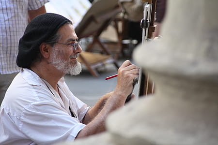 man drawing on canvas thumbnail