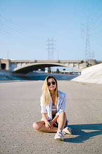 woman sitting on street at daytime thumbnail